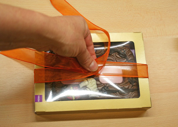 Holiday Gift Wrapping: How to tie ribbon around a gift box. Create Ribbon Around a Gift Box