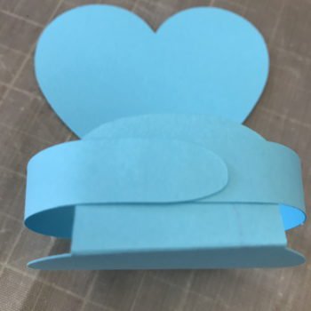 Glue Front Flap in Place Behind Arms