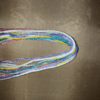 Fold 7in Lengths of Floss in Half