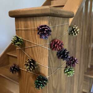 Pinecone Garland Decorating Newel Post