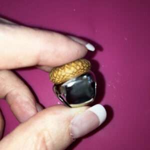 Place Acorn Cap on Top of Bell