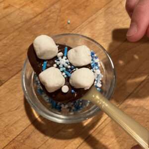 Add Toppings to Chocolate in the Spoon