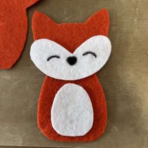 Glue Belly and Face to Fox Felt Finger Puppet