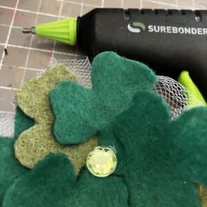Glue Rhinestone to Center of Shamrocks