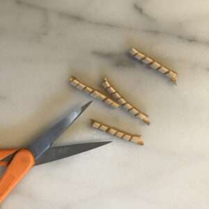 Cut Corkscrew Ribbon into 2 inch Lengths
