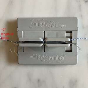 Place Twine and Bow Wire in Mini Bowdabra