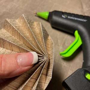 Add a Dab of Hot Glue to the Base to Hold It in Place